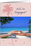 We’re engaged, beach theme, white sand, blue sky, hands reaching, card