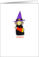 A Sweet Child Witch Holding a Big Candy Corn on a Halloween card