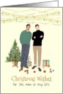 Interracial Couple Beside Christmas Tree Baubles and Gifts on Ground card