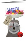 Christmas holiday greeting and baubles on a weighing scale card