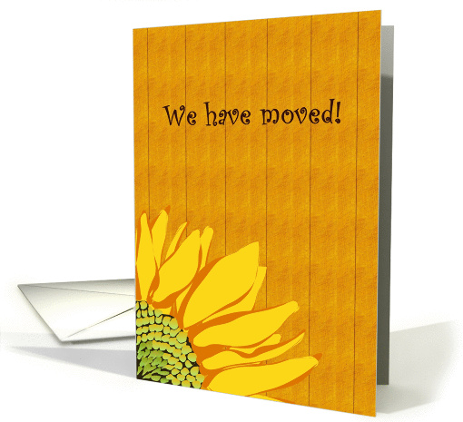 Sunflower moving announcement, sunflower against wood panel card
