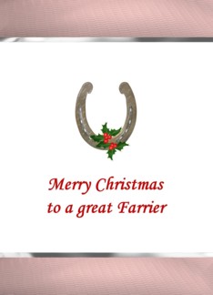 Christmas for farrier, holly berries resting on a horseshoe