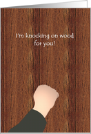 Knock on wood idiom, sending good luck, knuckle tapping on wood card