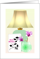 Birthday Card Standing Next To Vase Of Orchids And Table Lamp card