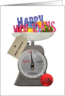 Christmas holiday greeting and baubles on a weighing scale card