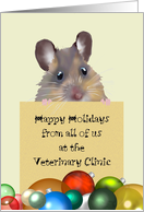 Happy holidays greeting from Veterinary Clinic, Mouse holding greeting note in front of baubles card