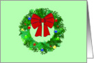 Christmas wreath decorated with big red bow, lights, and ornaments card