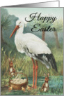 Happy Easter with White Stork in Nature with Egg Basket and Bunnies card