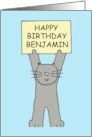 Happy Birthday Benjamin Cartoon Grey Cat Holding Up a Sign card