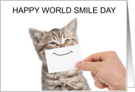 Happy World Smile Day Tabby Kitten with a Paper Smile card