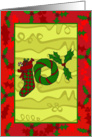Stocking, wreath and holly spelled ’JOY’ Christmas card