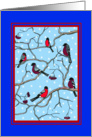 Group of bullfinches in a winter scene Christmas card