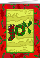Stocking, wreath and holly spelled ’JOY’ Christmas card