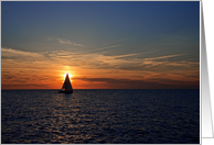 A sailboat silhouetted in the sunset blank card