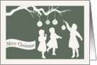 Girls Decorate a Tree with Ornaments for Christmas card
