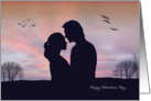 Loving Couple Stand Close in Front of Sunset for Valentines Day Card
