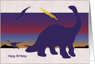 Silhouette Dinosaurs in Front of Fiery Sunset Birthday Card
