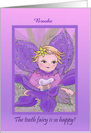 The tooth fairy is so happy! Adorable girl tooth fairy holding tooth card