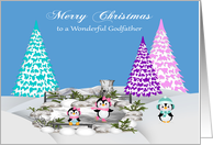 Christmas to Godfather, adorable penguins on ice and snow with trees card