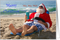 Christmas Beach Theme with Santa Claus Holding a Travel Cup card
