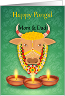Mom & Dad Happy Pongal, with cow and candles, on a green background card