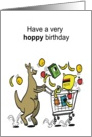 Cartoon kangaroo hopping along with groceries bouncing in trolley. card