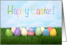 Colorful eggs in grass wishing Happy Easter card