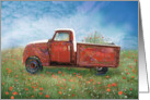 Red classic truck in field of flowers. card