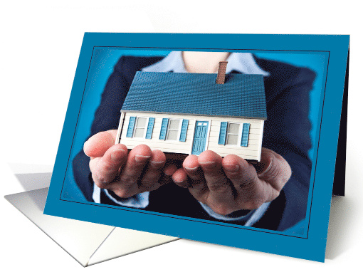 Thinking of Moving Hands Holding Small House card (1564366)
