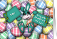 Easter for Niece, Teal Bunny Laying in the Easter Eggs card