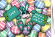 Easter for Cousin, Teal Bunny Laying in the Easter Eggs card
