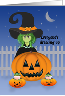 Child Dressed as a Green Halloween Witch Behind Giant Jack-o-lantern card