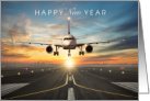 Happy New Year with Plane Landing on Runway at Sunset card