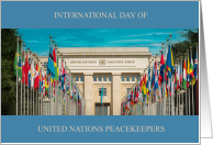International Day of United Nations Peacekeepers May 29 with UN building flags card
