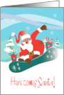 Hand Lettered Here Comes Santa Snow Boarding Santa with Gifts card