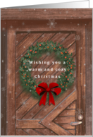 Warm and Cozy Christmas Wreath on Door with Festive Red Bow card