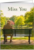 Miss You Senior Man on Park Bench by Lake