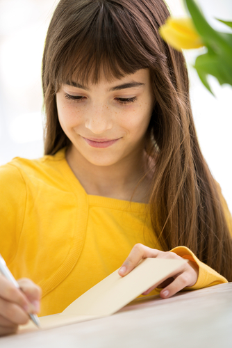 Girl Writing in a Greeting Card